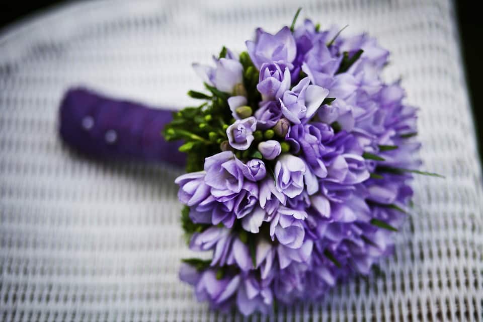 Seasonal Blooms - purple lavender flower bouquet on white chair