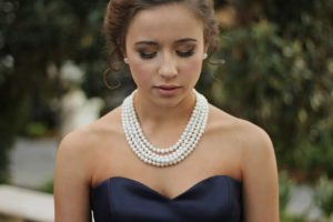 Woman Wearing Peal Necklace 30th wedding anniversary gift meaning