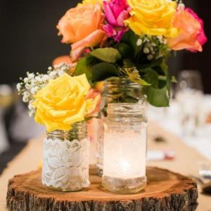 Seasonal Flowers on Rustic Timber Slice with Tealight