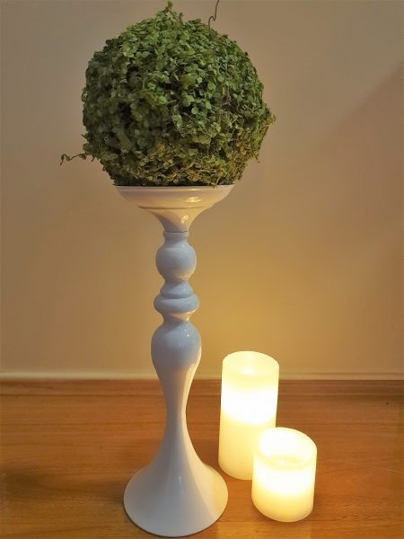 greenery ball on white stand with led candles