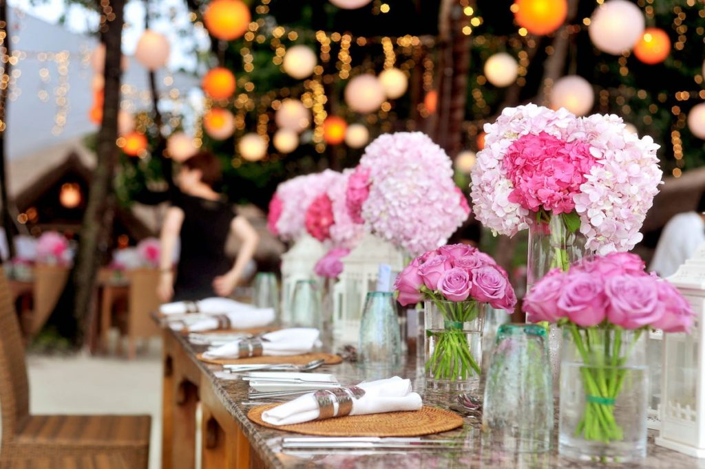 A photo of an event bump in set-up flowers and lights