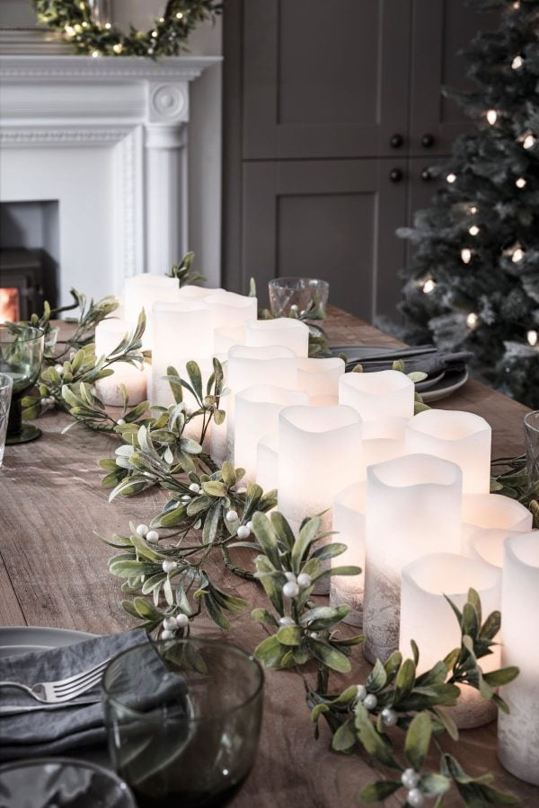 LED candles with greenery Christmas table runner