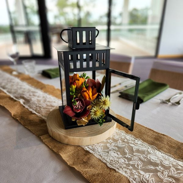 Black Lantern with Seasonal Flowers on Timber Slice