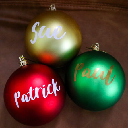 Name Baubles Gold Red Green on leather