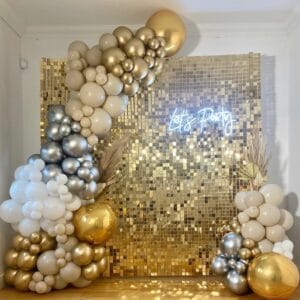 gold shimmer wall with balloon garland
