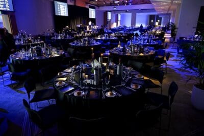 Sydney Roosters Awards Night Room Shot Event planning checklist for awards nights with a podium and warm stage lighting