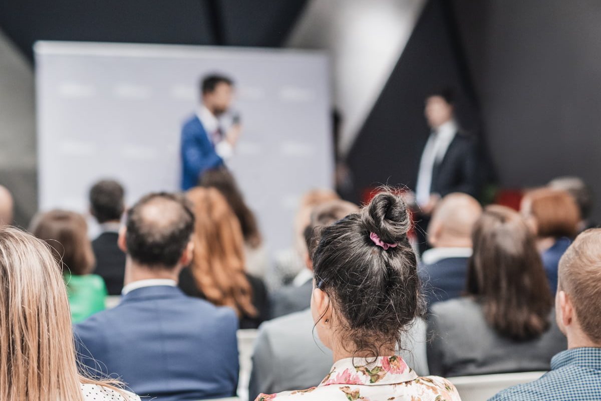 Pitch presentation and project discussion at business convention or team meeting. Audience at the conference hall. Business and entrepreneurship symposium. Pitch presentation and project discussion at business convention or team meeting. Audience at the conference hall. Business and entrepreneurship symposium.